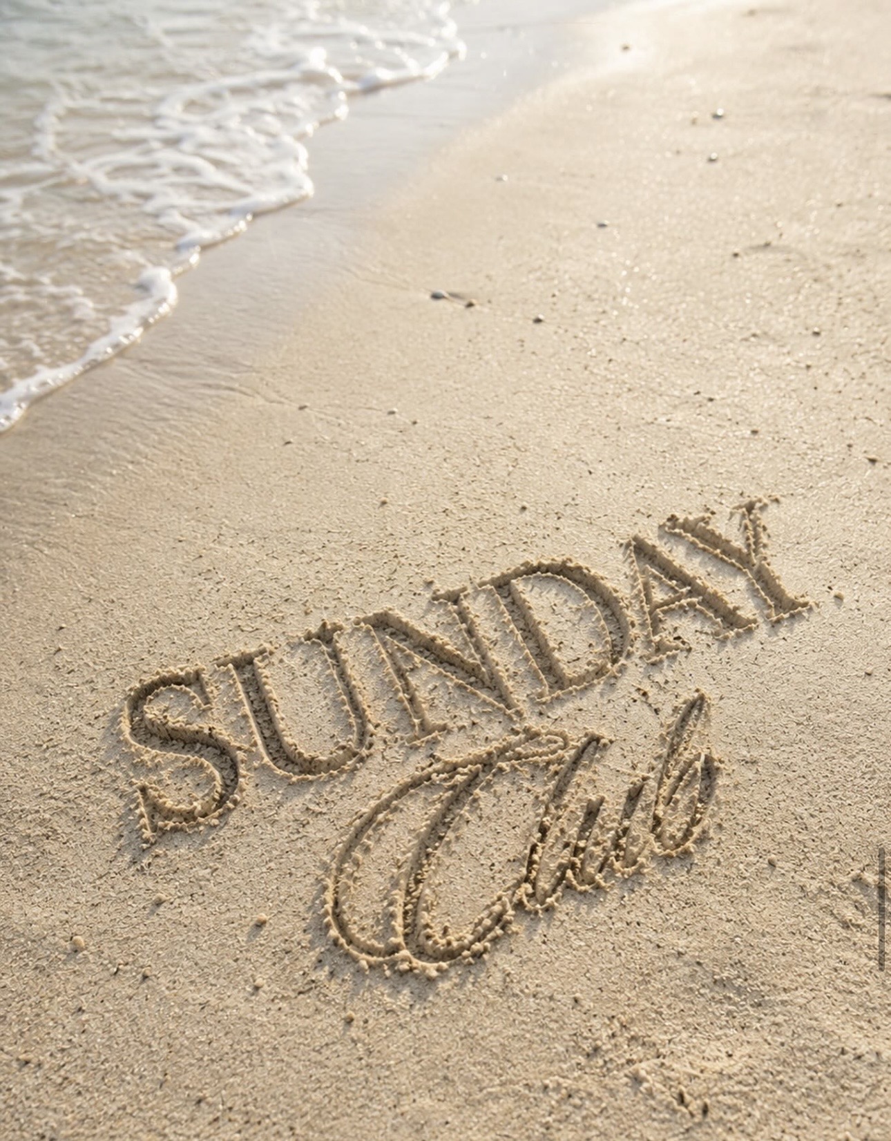 Sunday Club written in sand
